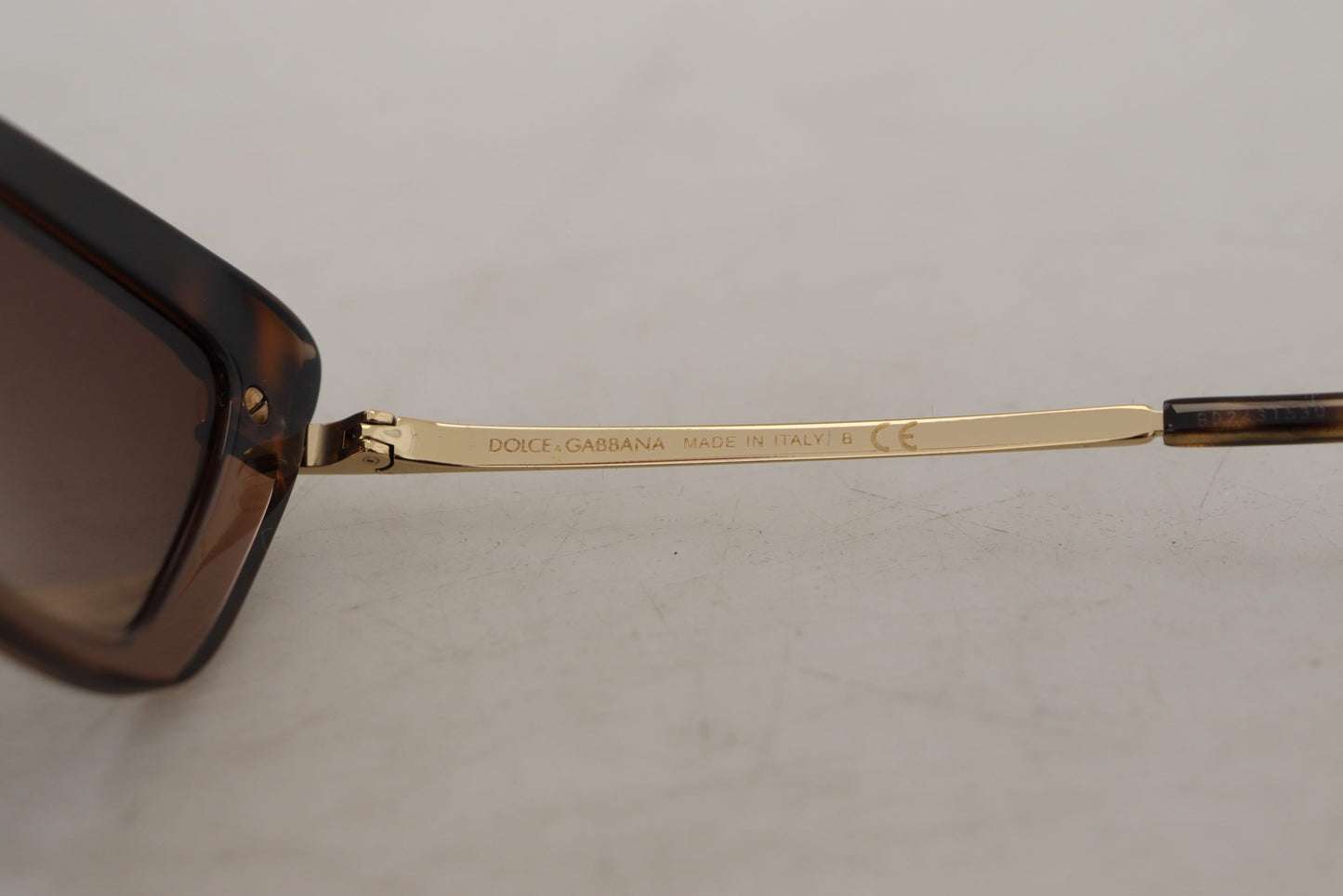 Dolce & Gabbana Elegant Cat Eye Sunglasses in Brown & Gold