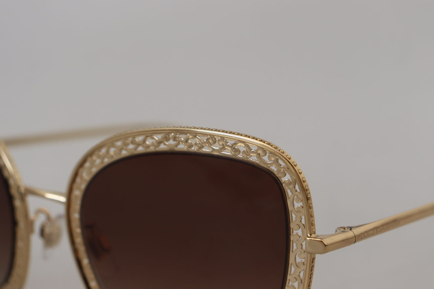 Dolce & Gabbana Elegant Lace-Patterned Gold Sunglasses